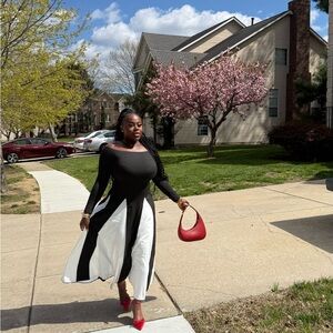 Elegant Black and White Dress with Red Accessories